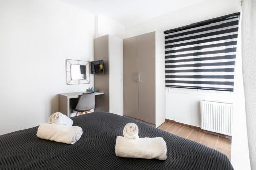 A bed or beds in a room at Sleeping Beauty Apartment City Center!!