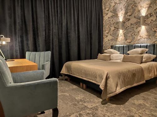 Postel nebo postele na pokoji v ubytování Hotel Szara Willa