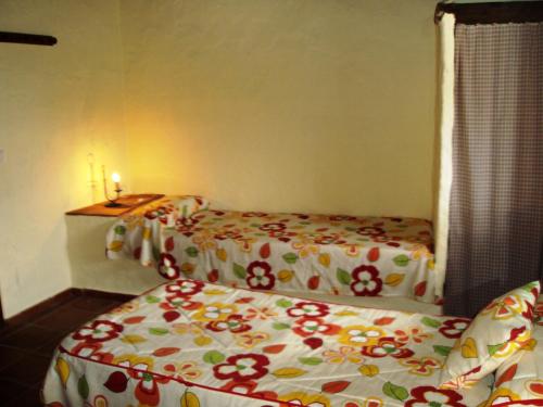 En eller flere senge i et værelse på Casa Antoñita