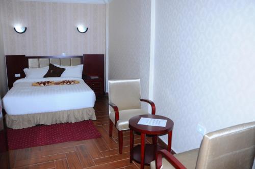 Guzara Hotel Addisにあるベッド
