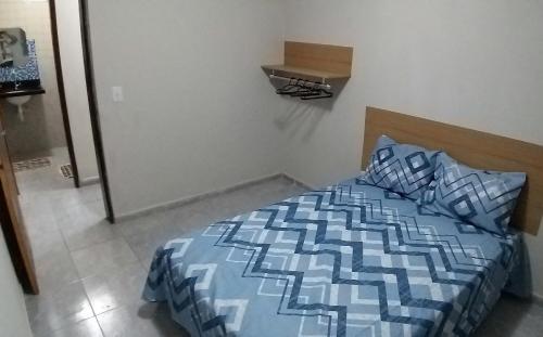 Ein Bett oder Betten in einem Zimmer der Unterkunft Apartamento Bela Vista perto da Praia para 08 pessoas