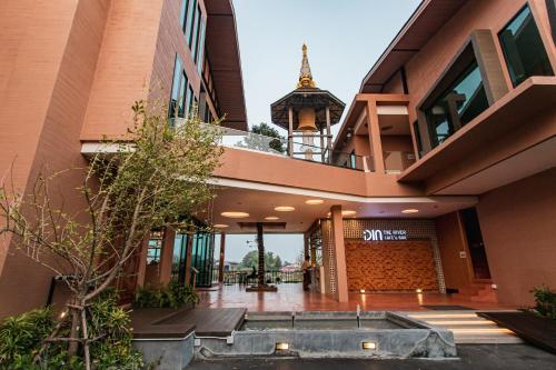 a view of a building with a clock tower at Rachabhura Hotel in Ratchaburi