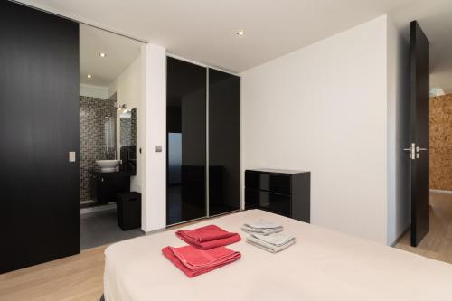 מיטה או מיטות בחדר ב-Luxo & Conforto