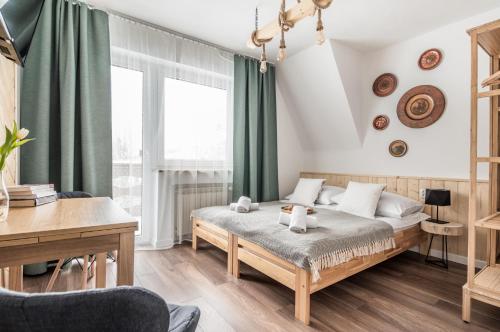 Posteľ alebo postele v izbe v ubytovaní Apartamenty Smrekowa Turnia