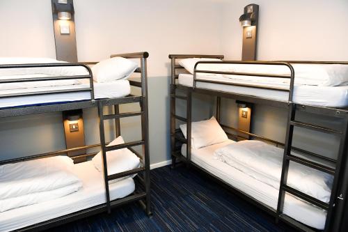 two sets of bunk beds in a room at Kabannas London St Pancras in London
