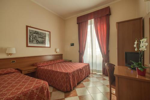 Ένα ή περισσότερα κρεβάτια σε δωμάτιο στο Hotel RomAntica