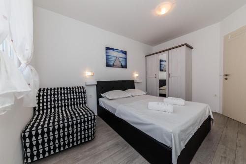 Postel nebo postele na pokoji v ubytování Villa Luana