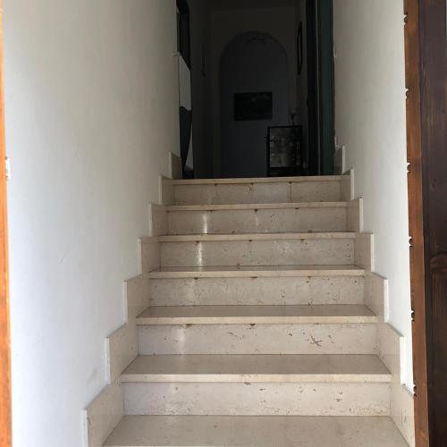 a stairway leading to a hallway with a stair case at alloggio turistico olmata in Montevirginio