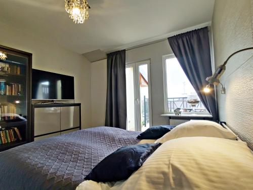 Postel nebo postele na pokoji v ubytování Apartament Mercedes by Baltic Home