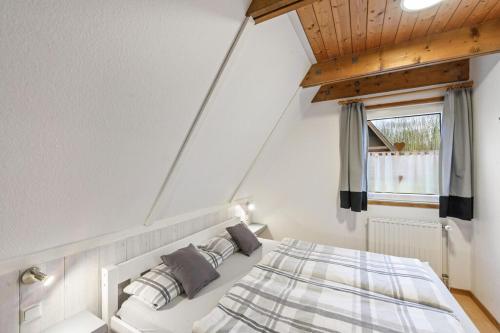 Ένα ή περισσότερα κρεβάτια σε δωμάτιο στο Ferienhaus Hannah 100