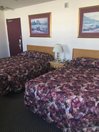 Postel nebo postele na pokoji v ubytování Almada Inn