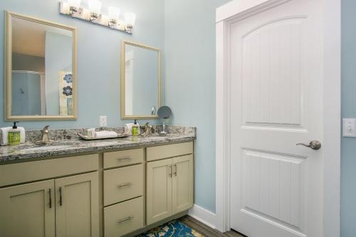 a bathroom with a sink and a mirror at Blue Haven in South Haven