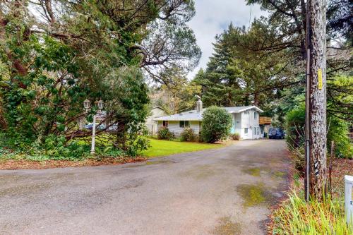 an empty street in a house with trees at Abalone Rose in Newport