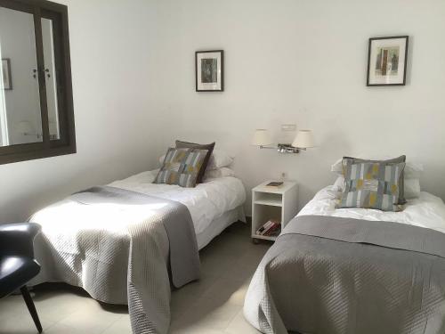 Ein Bett oder Betten in einem Zimmer der Unterkunft Sea views modern villa for relaxing holidays