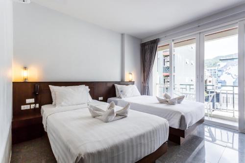 Postel nebo postele na pokoji v ubytování 77 Bangla Hotel - SHA Certified