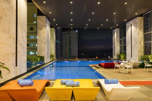 a swimming pool in the middle of a building at Libra Nha Trang in Nha Trang