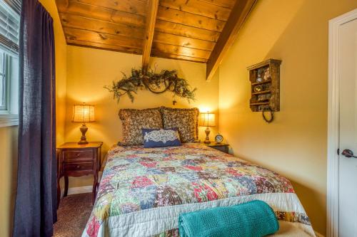 a bedroom with a bed and a wooden ceiling at Bear Paradise in Lake Arrowhead