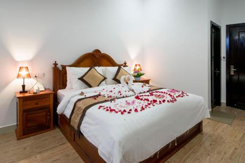 Katil atau katil-katil dalam bilik di Aristocrat Residence & Hotel