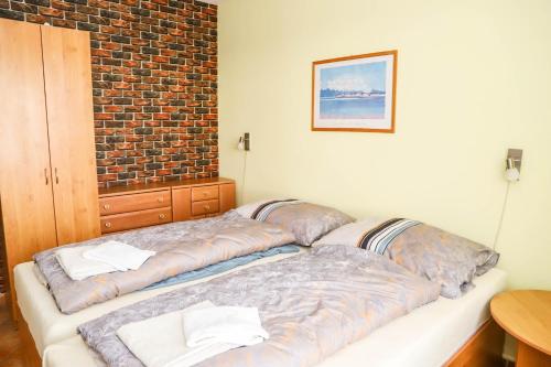 Ένα ή περισσότερα κρεβάτια σε δωμάτιο στο Hotel Zátoka