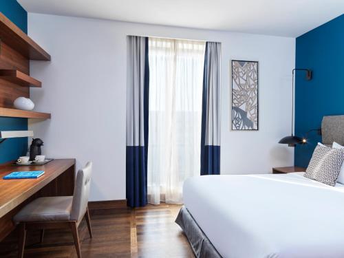 
A bed or beds in a room at Metropol Palace, a Luxury Collection Hotel, Belgrade
