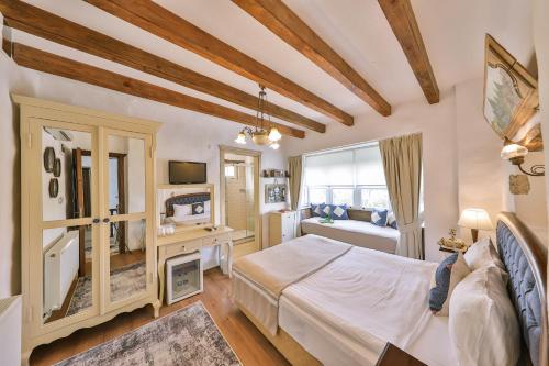 Ένα ή περισσότερα κρεβάτια σε δωμάτιο στο Cumbali Konak Hotel (Adults Only +12)