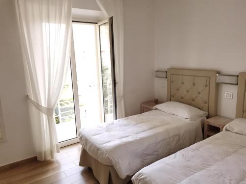 เตียงในห้องที่ Hotel Di Nardo