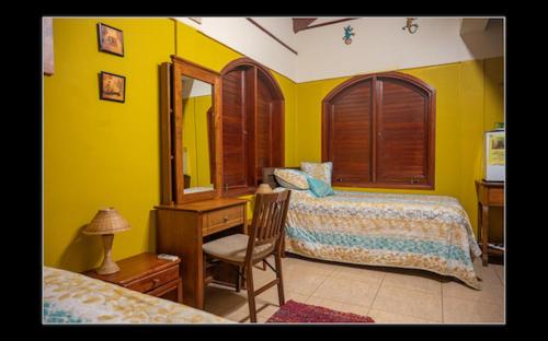 Ένα ή περισσότερα κρεβάτια σε δωμάτιο στο Fuego Mio Bed & Breakfast