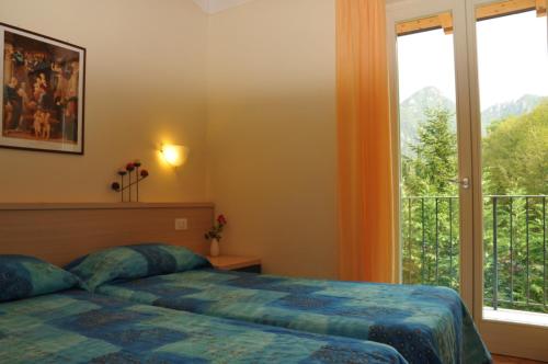 Ein Bett oder Betten in einem Zimmer der Unterkunft Vico Sweet mountain view