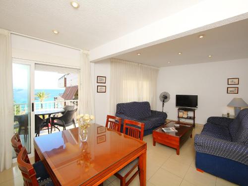 a living room with a couch and a table at Apartment Giner by Interhome in Benidorm