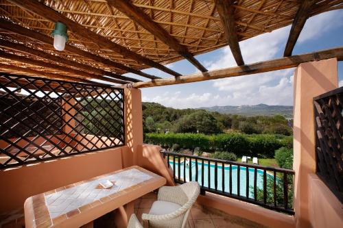 a balcony with a table and chairs and a view at Green Park Hotel in Porto Cervo
