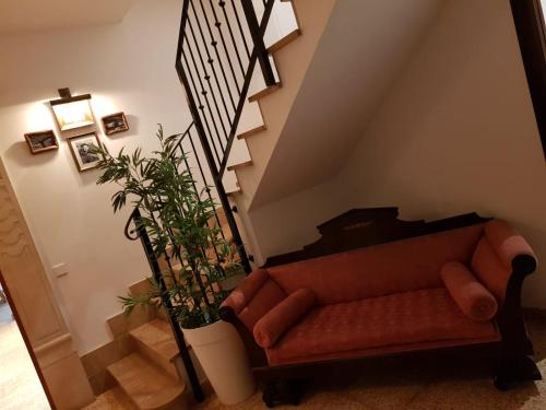 a living room with a couch and a staircase at Villa Dinastía Resort Lujo in Llucmajor