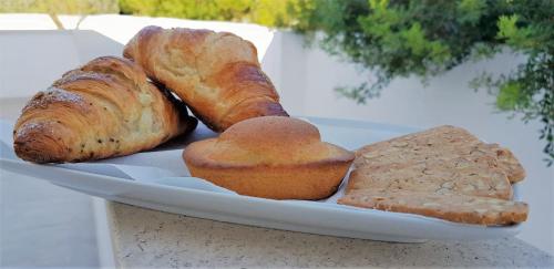 a plate of bread and pastries on a table at I 7 Peccati in Marina di Mancaversa