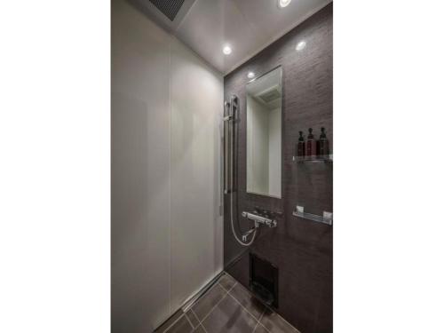 a bathroom with a shower and a mirror at THE LIVELY AZABUJUBAN TOKYO / Vacation STAY 77702 in Tokyo