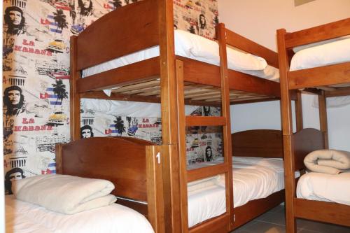 a bunk bed room with two bunk beds at Meeting Hostel in Figueira da Foz