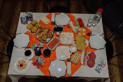 a table with food and drinks on top of it at Hotel Eurica in Kutaisi