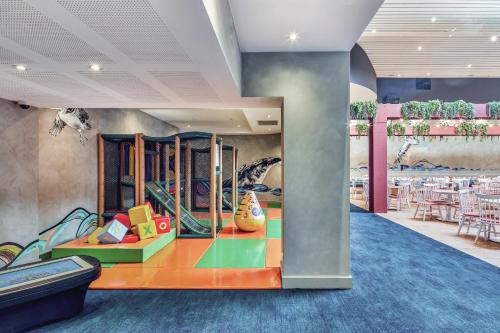 a living room filled with lots of furniture at Ibis Styles The Entrance in The Entrance