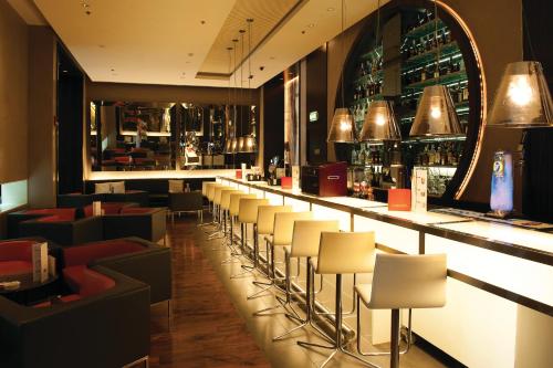 Area soggiorno di Centro Barsha - by Rotana