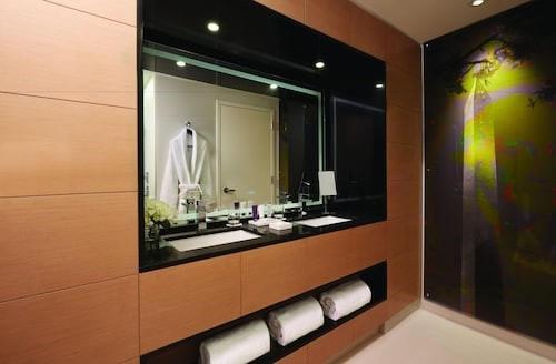 a bathroom with a large mirror and a sink at MGM National Harbor in National Harbor