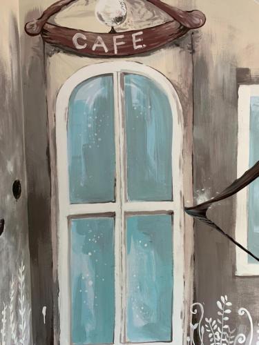 a painting of a window with a cafe sign at 安禾居 AnHeJu B&B in Miaoli