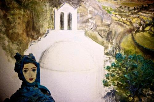 a painting of a woman in front of a church at Platys Gialos Hotel Sifnos in Platis Yialos Sifnos