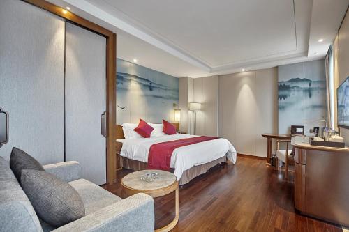 Grand Metro Park Hotel Nanningにあるベッド