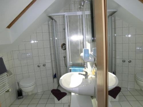 a bathroom with a sink and a toilet at Haus Bagci in Füssen