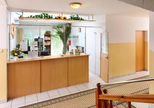 a waiting room with a counter in a building at Zajazd Ustronie in Piaseczno
