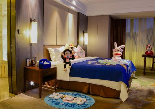 Grand Metro Park Hotel Nanningにあるベッド