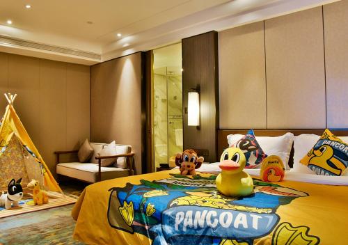 Grand Metro Park Hotel Nanningにあるベッド