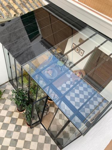 a view of a glass table in a room at Hospederia Santa Clara in Utrera
