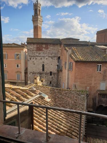 a view of an old building with a clock tower at Albergo Centrale in Siena