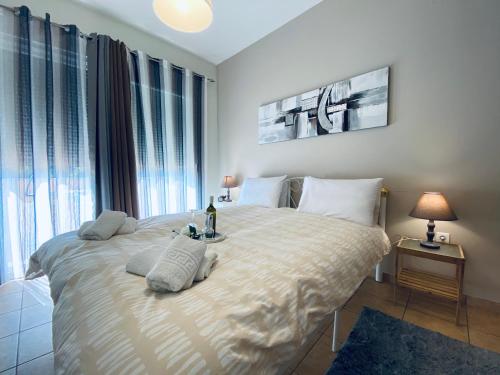 a bedroom with a large bed with two pillows on it at Rosa Bianca in Kanálion