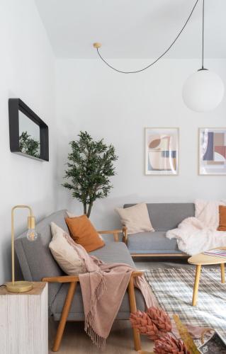 a living room with a couch and a table at Bilbao Park by Aston Rentals in Bilbao