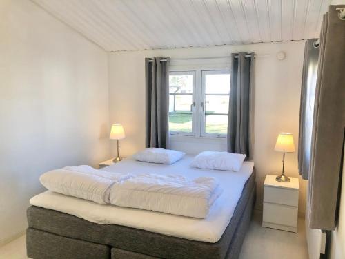 En eller flere senge i et værelse på Falsterbo Camping Resort